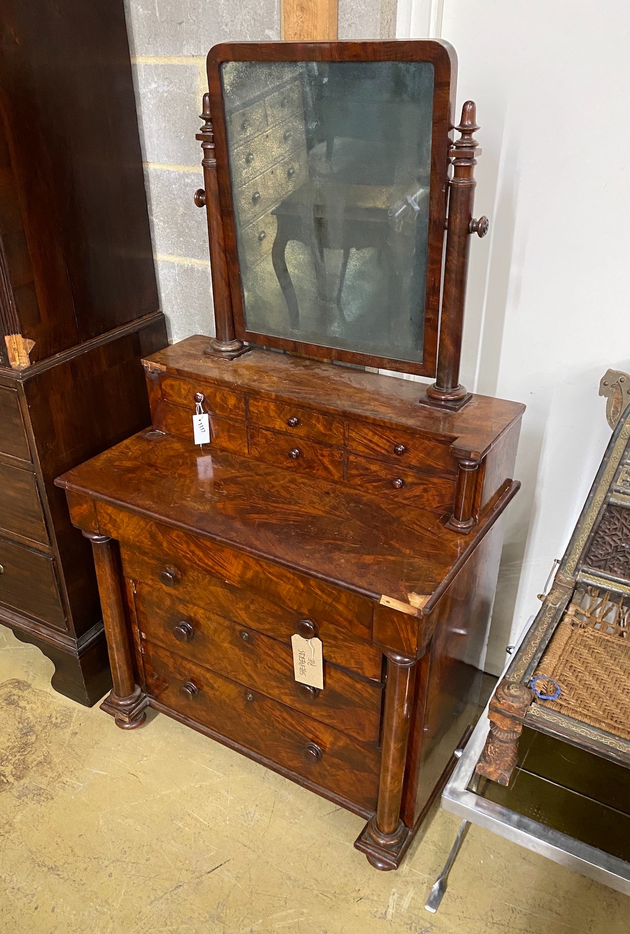 A 19th century French flame mahogany dressing chest, width 90cm